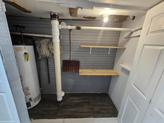 utility room with water heater