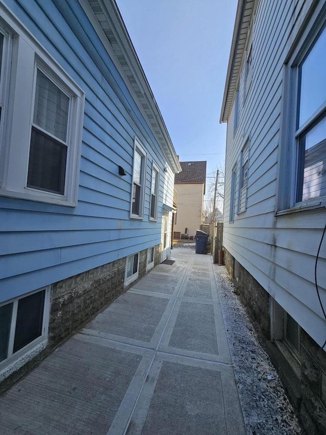 view of side of property with a patio