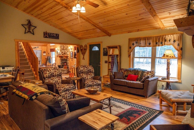 living room featuring ceiling fan, wooden ceiling, hardwood / wood-style floors, and vaulted ceiling with beams