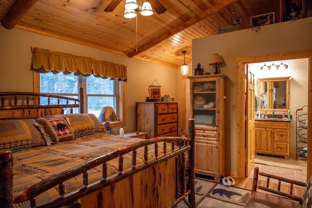 bedroom with light wood-type flooring, ensuite bath, lofted ceiling with beams, and wooden ceiling