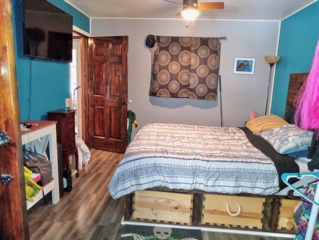 bedroom with wood finished floors