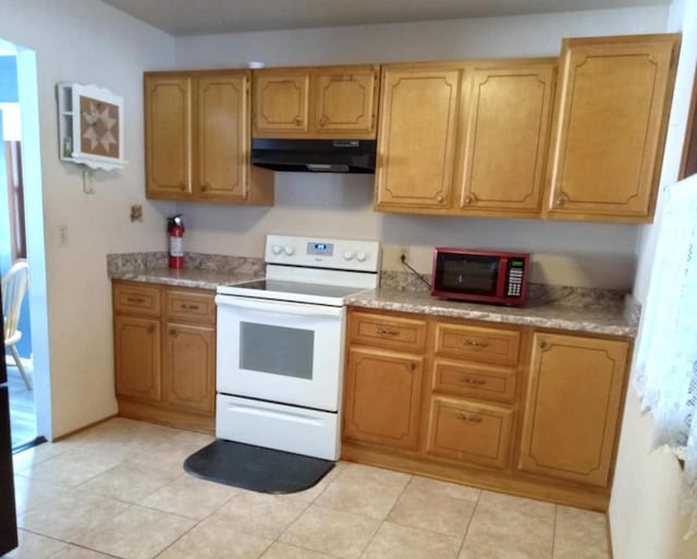 kitchen featuring light countertops, light tile patterned floors, under cabinet range hood, and white range with electric cooktop