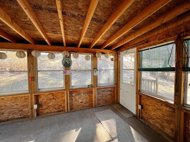 unfurnished sunroom featuring a healthy amount of sunlight