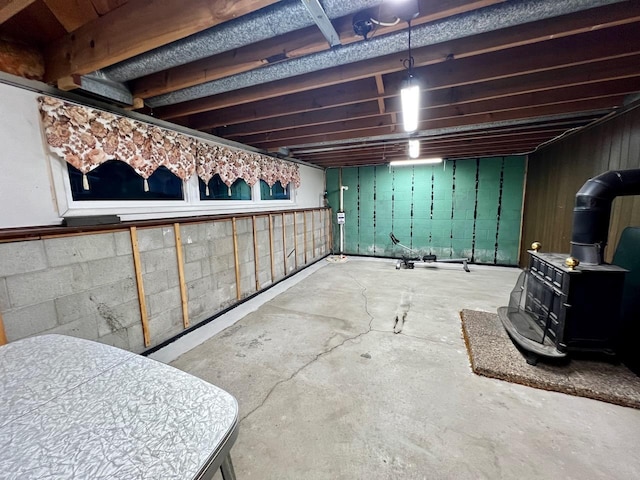 unfinished basement with concrete block wall