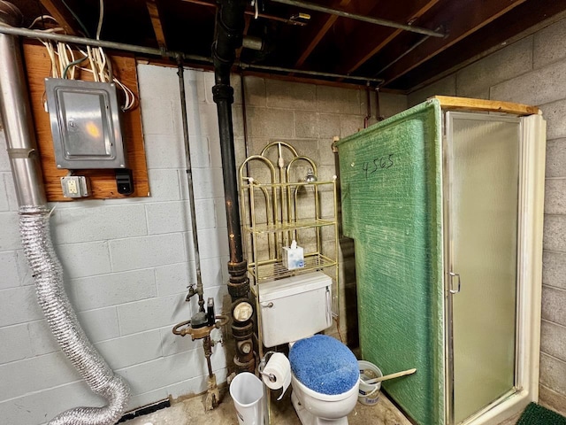 full bathroom with electric panel, a stall shower, toilet, and unfinished concrete flooring