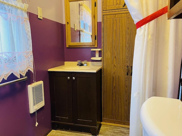 W7679 Oak St, Shiocton, WI 54170 - bathroom featuring hardwood / wood-style flooring and vanity