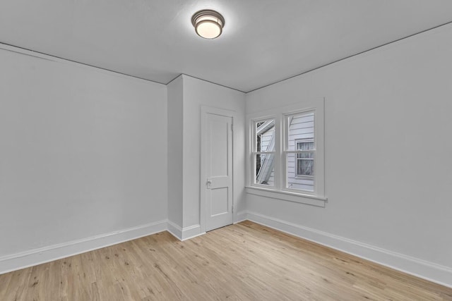 spare room with light wood-type flooring