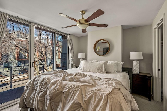 bedroom with ceiling fan, floor to ceiling windows, carpet flooring, and access to exterior