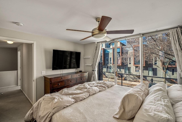 carpeted bedroom with expansive windows, access to outside, ceiling fan, and baseboards