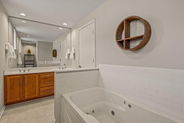 full bathroom featuring a jetted tub, tile patterned flooring, vanity, and recessed lighting