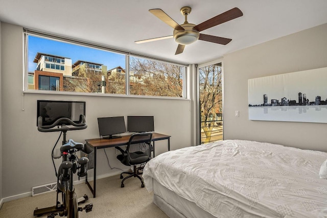 bedroom featuring carpet floors, visible vents, baseboards, and a ceiling fan