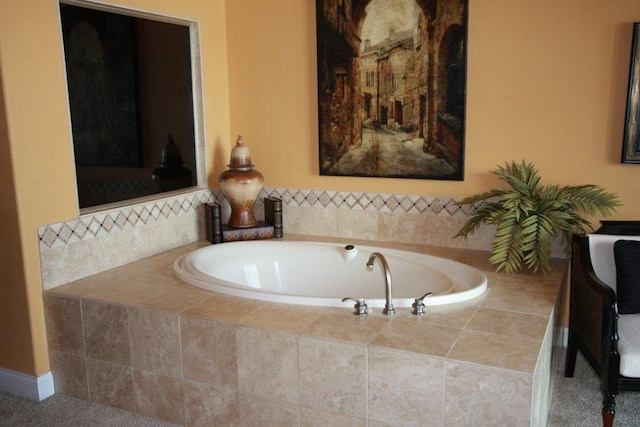 bathroom with tiled bath