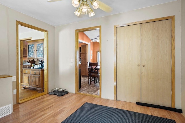 interior space with ceiling fan and light wood-type flooring