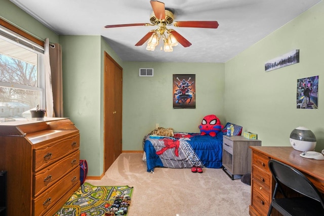 carpeted bedroom featuring ceiling fan