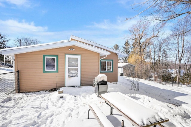 view of snow covered house