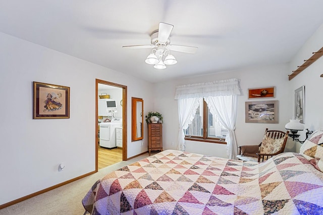 carpeted bedroom featuring ensuite bathroom, washer / dryer, and ceiling fan