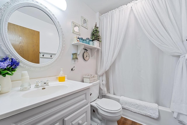 full bathroom featuring vanity, wood-type flooring, shower / bath combination with curtain, and toilet