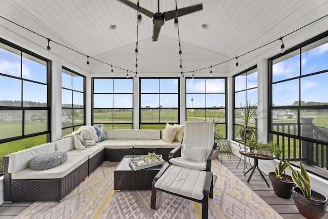 sunroom / solarium featuring vaulted ceiling with beams and wooden ceiling