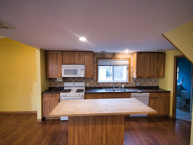 24713 68th St, Salem, WI 53168 - kitchen with butcher block counters, sink, a center island, dark hardwood / wood-style flooring, and white appliances