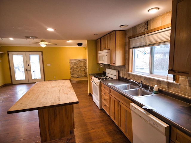 24713 68th St, Salem, WI 53168 - kitchen with sink, white appliances, wooden counters, a healthy amount of sunlight, and a kitchen island