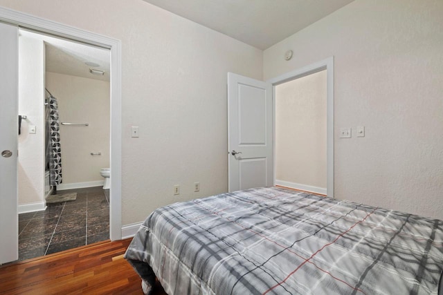 bedroom with hardwood / wood-style flooring