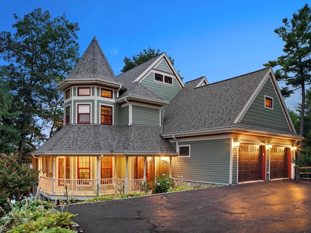 N7417 County Road Cj, Plymouth, WI 53073 - victorian home with driveway, covered porch, a shingled roof, and a garage