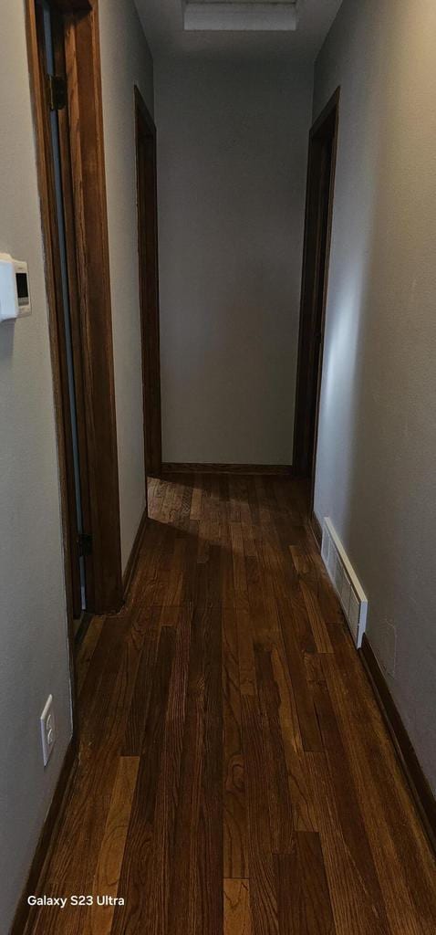 hallway featuring dark hardwood / wood-style floors