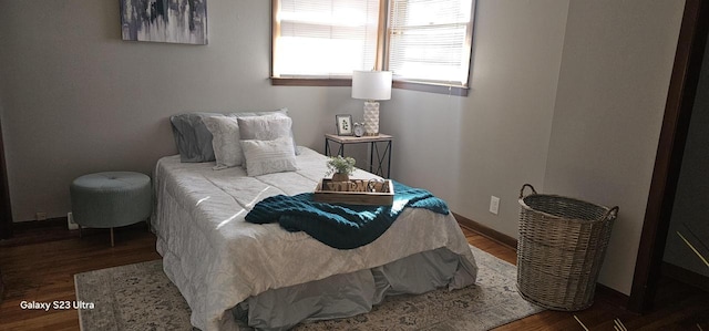 bedroom featuring dark wood-type flooring