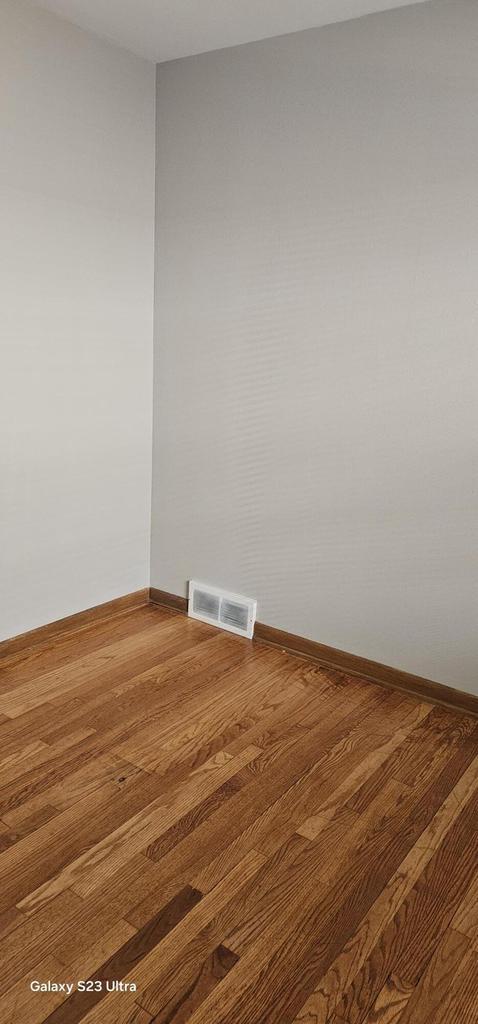 empty room featuring hardwood / wood-style flooring