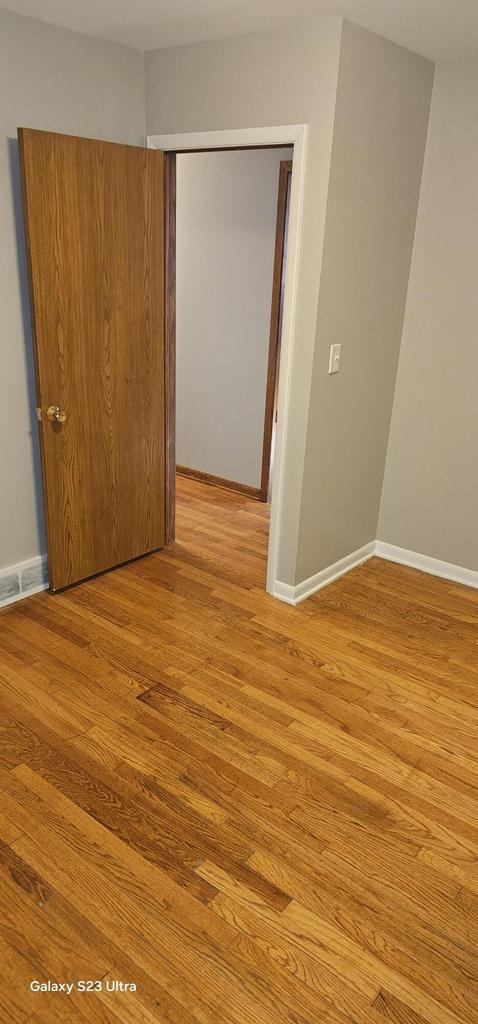 unfurnished room with light hardwood / wood-style flooring