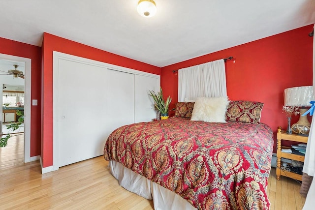 bedroom featuring light hardwood / wood-style flooring and a closet