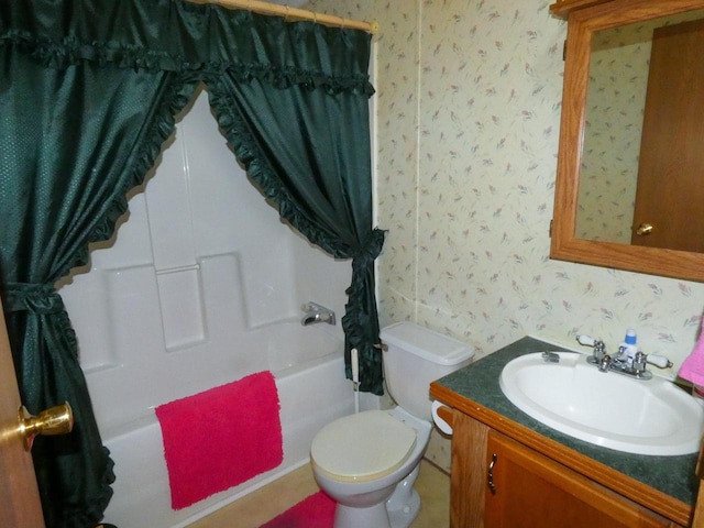 full bathroom with shower / bath combo, vanity, and toilet