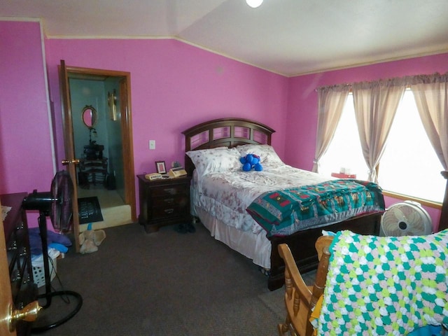 bedroom with carpet floors and vaulted ceiling