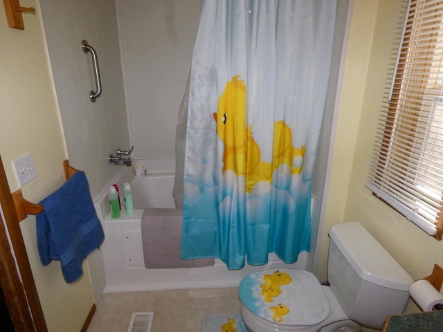 bathroom with shower / bath combo and a wealth of natural light