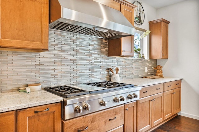1452 Serenity Ct, Sun Prairie, WI 53590 - kitchen with wall chimney range hood, dark wood-style flooring, baseboards, stainless steel gas stovetop, and tasteful backsplash