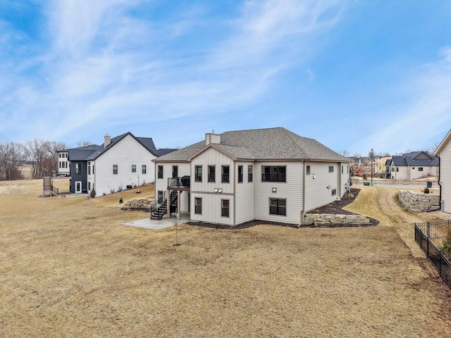 1452 Serenity Ct, Sun Prairie, WI 53590 - rear view of house featuring fence, a residential view, stairs, board and batten siding, and a deck