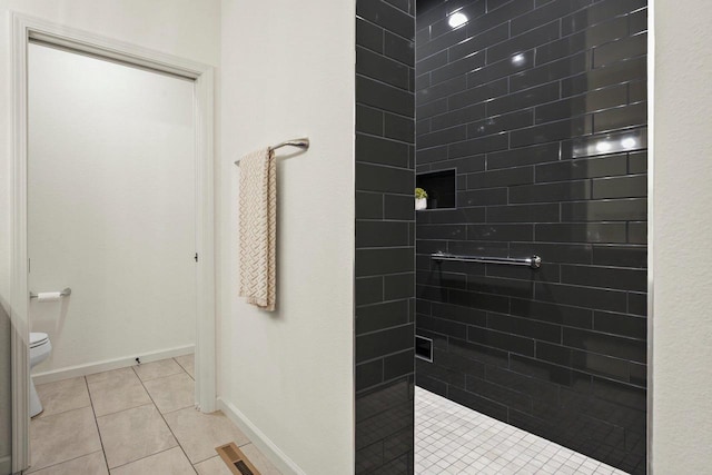 1452 Serenity Ct, Sun Prairie, WI 53590 - full bath with visible vents, tile patterned flooring, baseboards, toilet, and tiled shower