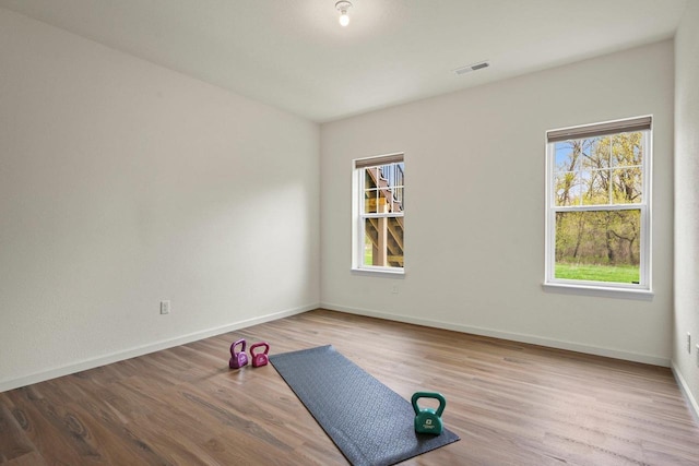 1452 Serenity Ct, Sun Prairie, WI 53590 - workout room with visible vents, baseboards, and wood finished floors