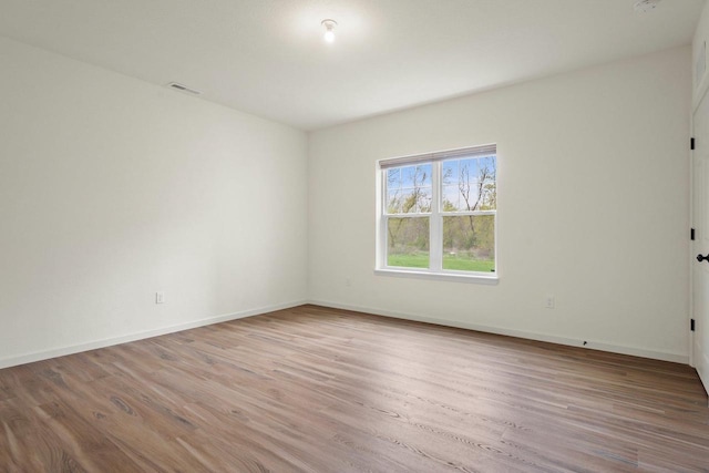 1452 Serenity Ct, Sun Prairie, WI 53590 - unfurnished room featuring baseboards, visible vents, and wood finished floors