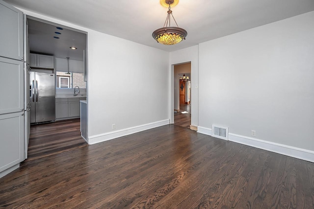 interior space featuring sink and dark hardwood / wood-style flooring