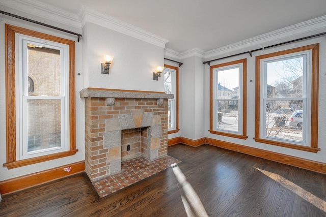 unfurnished living room featuring crown molding, a brick fireplace, and dark hardwood / wood-style floors