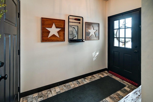 entryway featuring baseboards