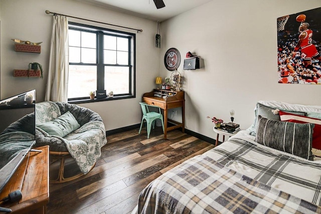 bedroom featuring hardwood / wood-style floors, a ceiling fan, and baseboards