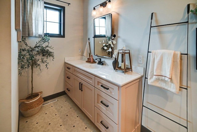 bathroom with visible vents, plenty of natural light, and vanity