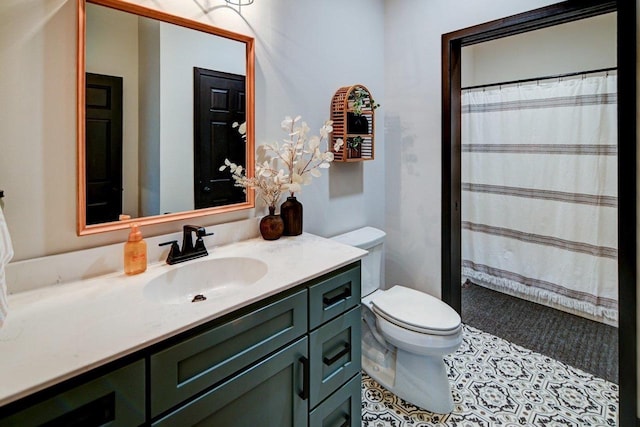 full bath featuring toilet, tile patterned floors, a shower with curtain, and vanity