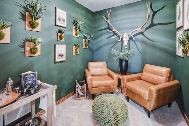 living area with carpet and baseboards