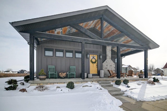 view of front facade with a porch and board and batten siding