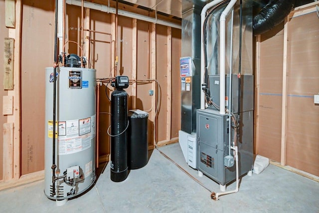 utility room featuring heating unit and water heater