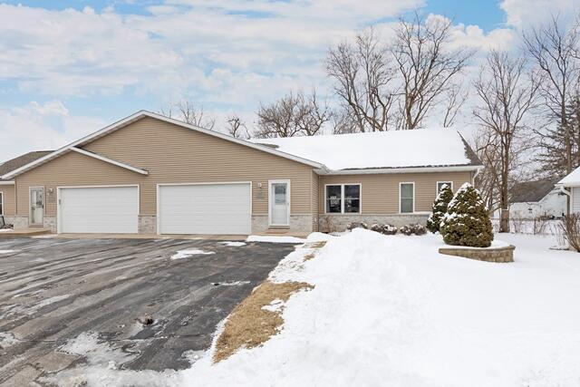 single story home featuring a garage