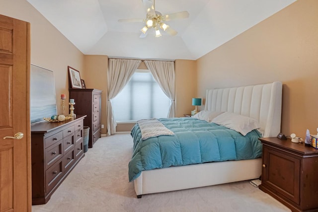 carpeted bedroom featuring lofted ceiling and ceiling fan